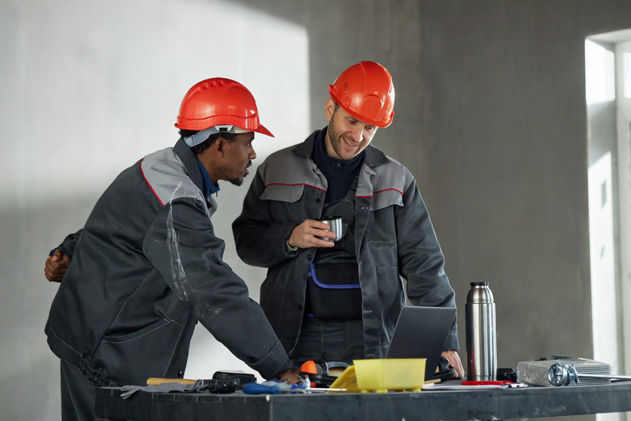 Site team in PPE coordinating works on a project