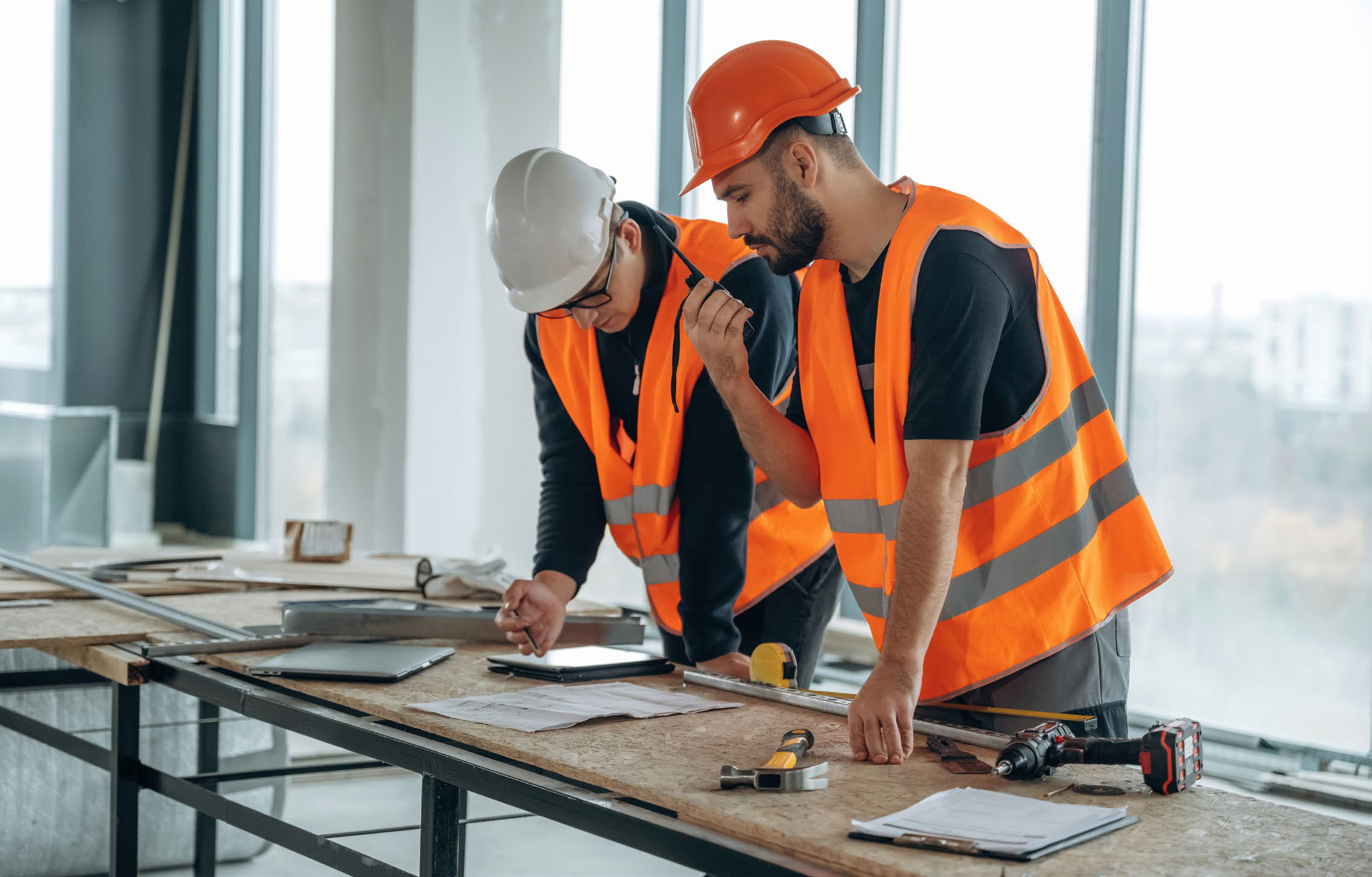 Site supervisors in PPE on a construction site