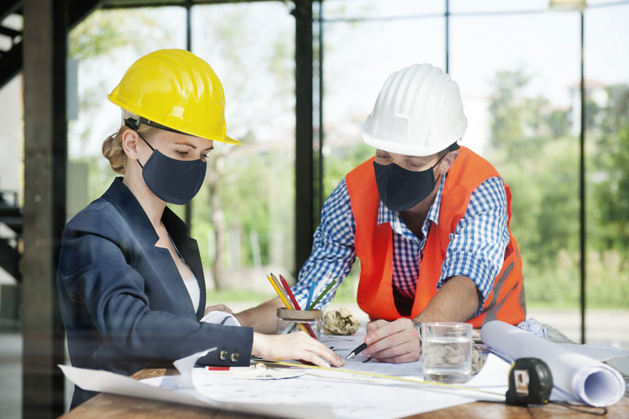 Workers in safety gear on site